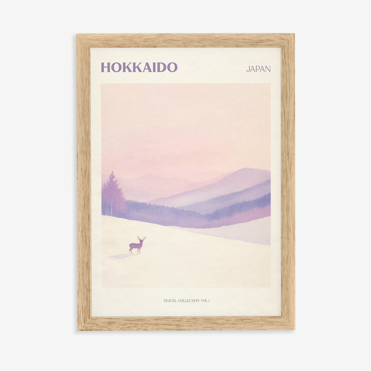 Hokkaido travel print of a lone deer in deep snow below soft pink and lilac hills, in an oak frame on a plain wall