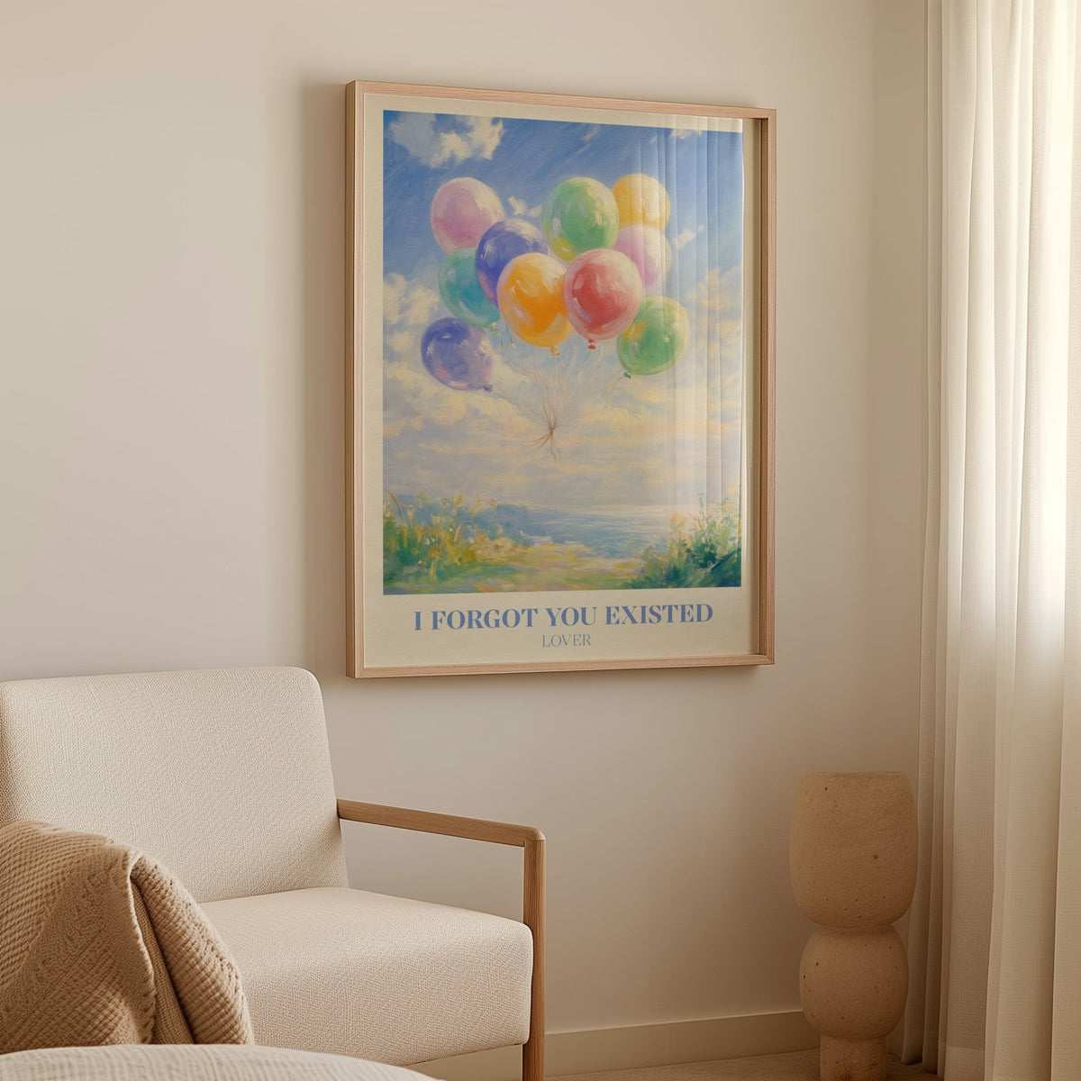 I Forgot You Existed Taylor Swift print of pastel balloons floating over the sea, framed above a cream armchair