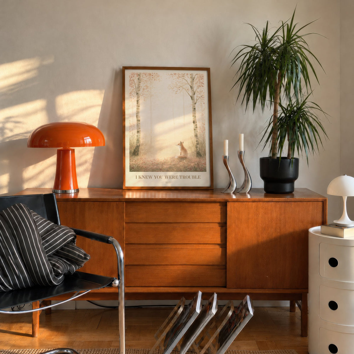 I Knew You Were Trouble Taylor Swift print of a fox in a birch wood, leaning on a mid-century sideboard beside an orange lamp
