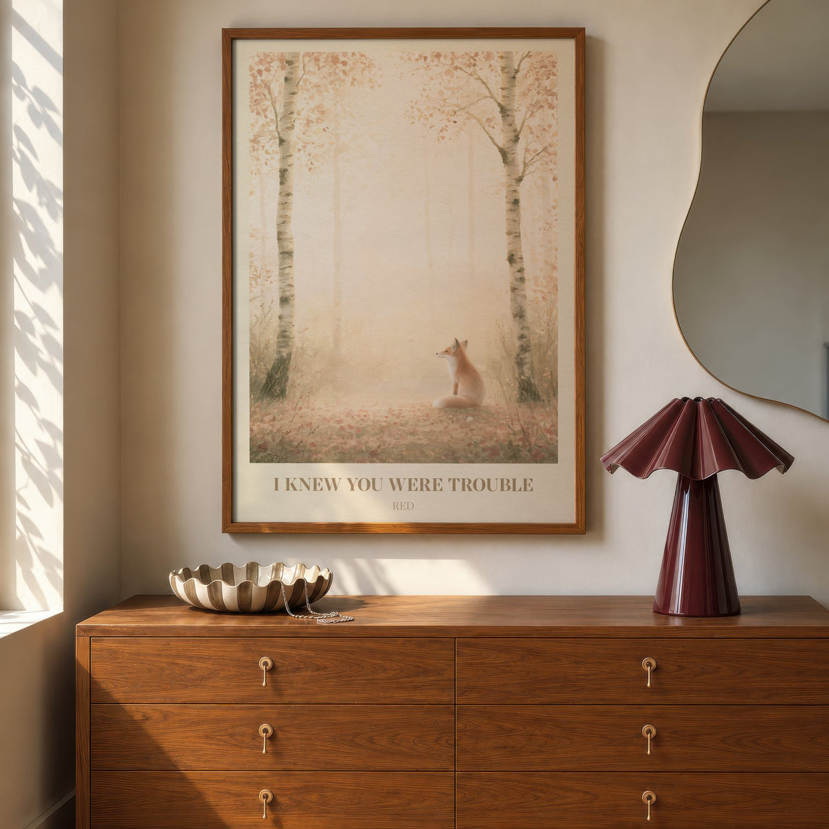 I Knew You Were Trouble Taylor Swift print of a fox in a birch wood, hung above a walnut dresser beside a wavy mirror and a pleated lamp