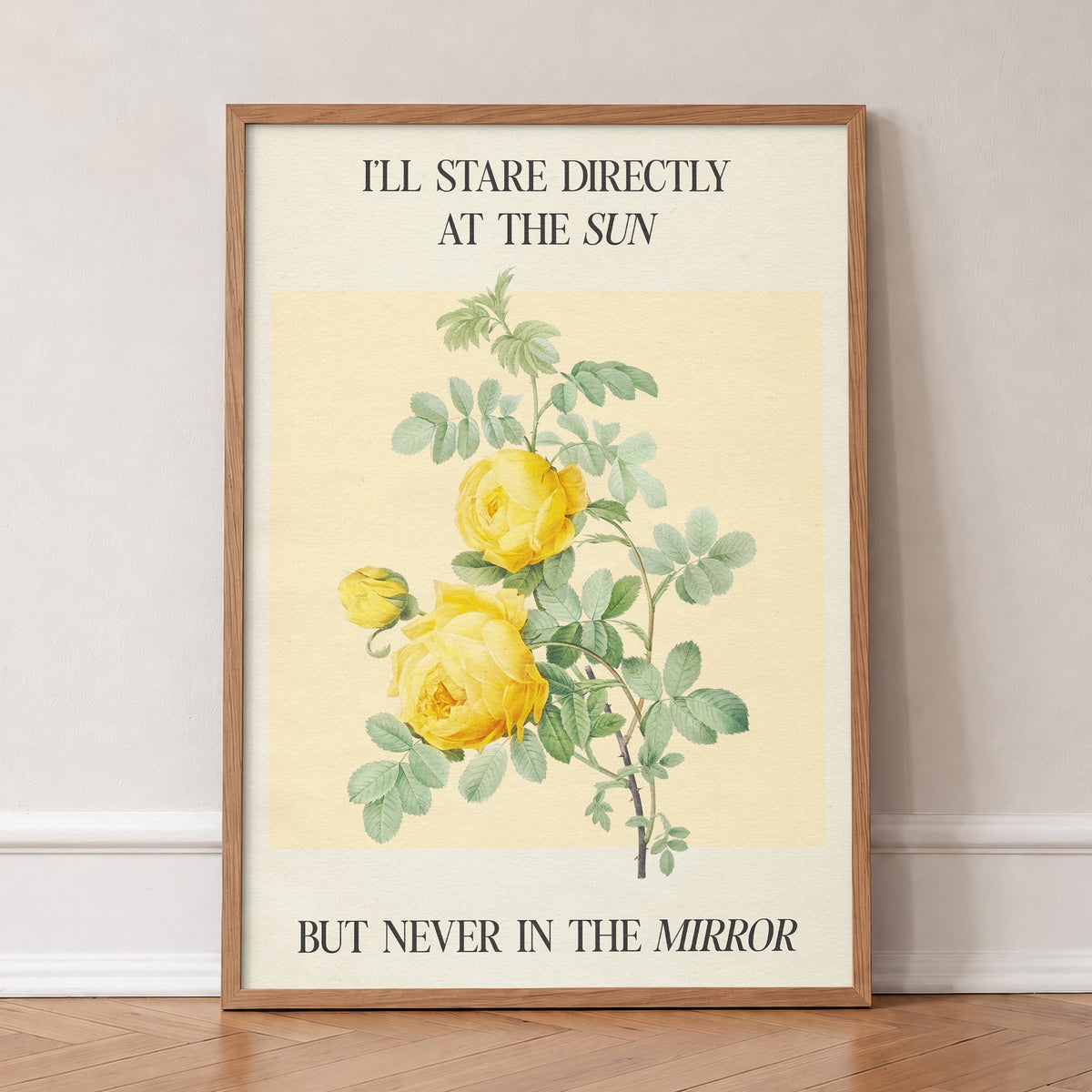 I Stare Directly At The Sun Taylor Swift lyric print of yellow roses and an Anti-Hero lyric, in an oak frame, leaning against a wall on a herringbone floor
