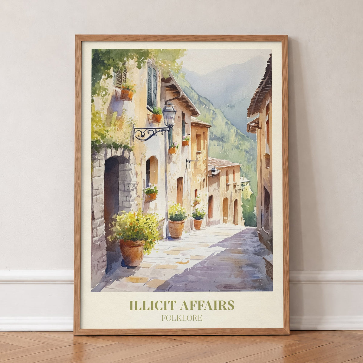 Illicit Affairs Taylor Swift print of a cobbled lane of stone houses and flowerpots, in an oak frame, leaning against a wall on a herringbone floor