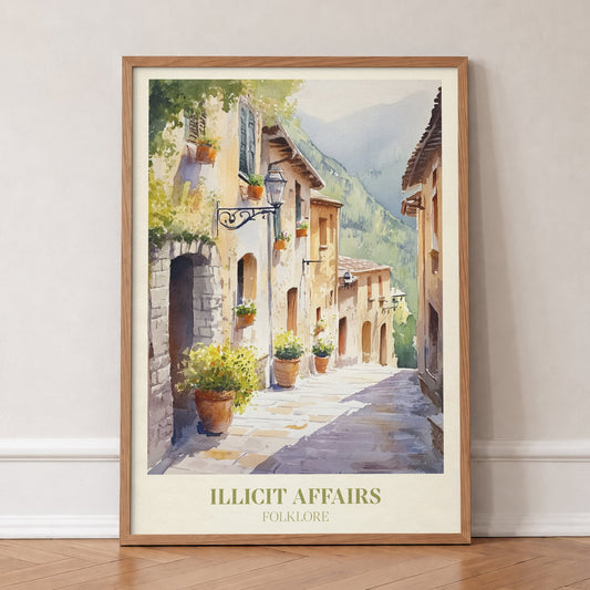 Illicit Affairs Taylor Swift print of a cobbled lane of stone houses and flowerpots, in an oak frame, leaning against a wall on a herringbone floor