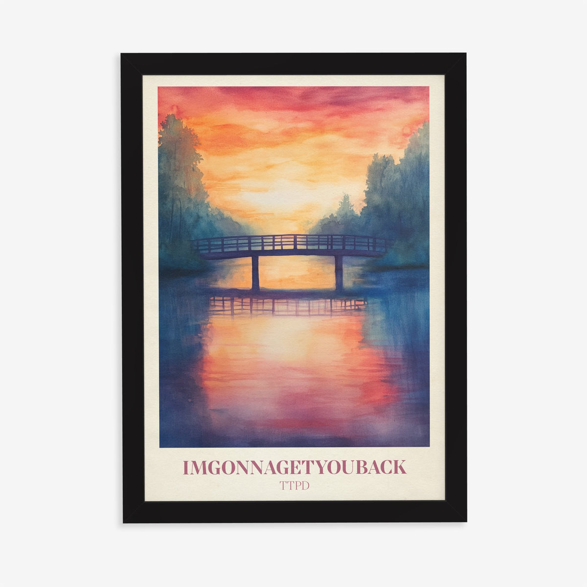 Imgonnagetyouback Taylor Swift print of a footbridge over a river at a fiery sunset, in a black frame on a plain wall