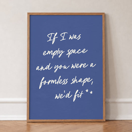 If I Was Empty Space Noah Kahan lyric print in cream handwriting on deep blue, in an oak frame, leaning against a wall on a herringbone floor