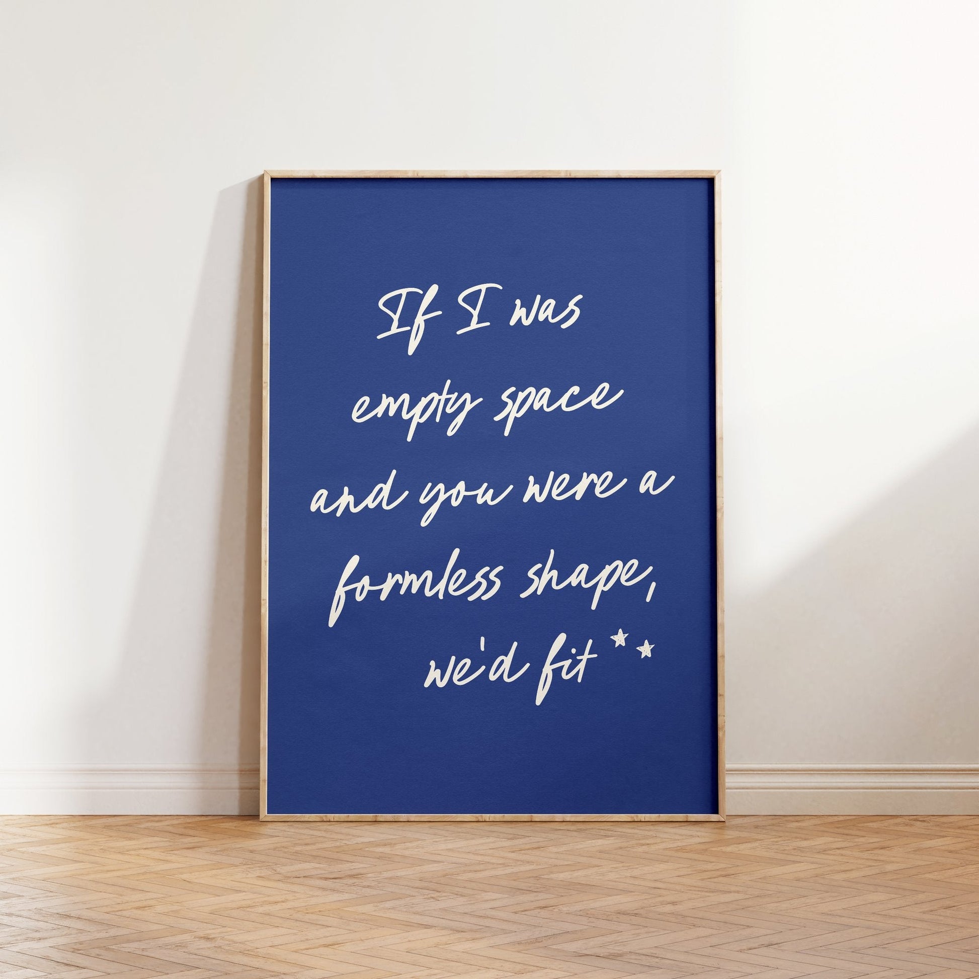 If I Was Empty Space lyric print inspired by Noah Kahan leaning against a white wall on a wooden herringbone floor in soft daylight
