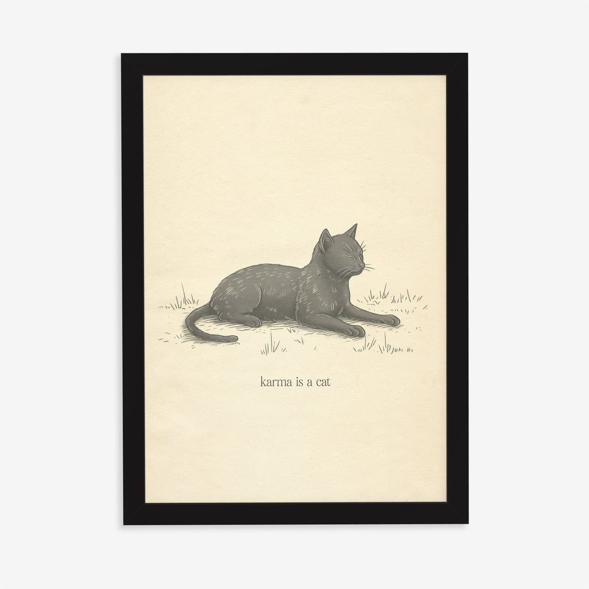 Karma Is A Cat Minimal Taylor Swift print of a sketch of a grey cat dozing in grass, in a black frame on a plain wall
