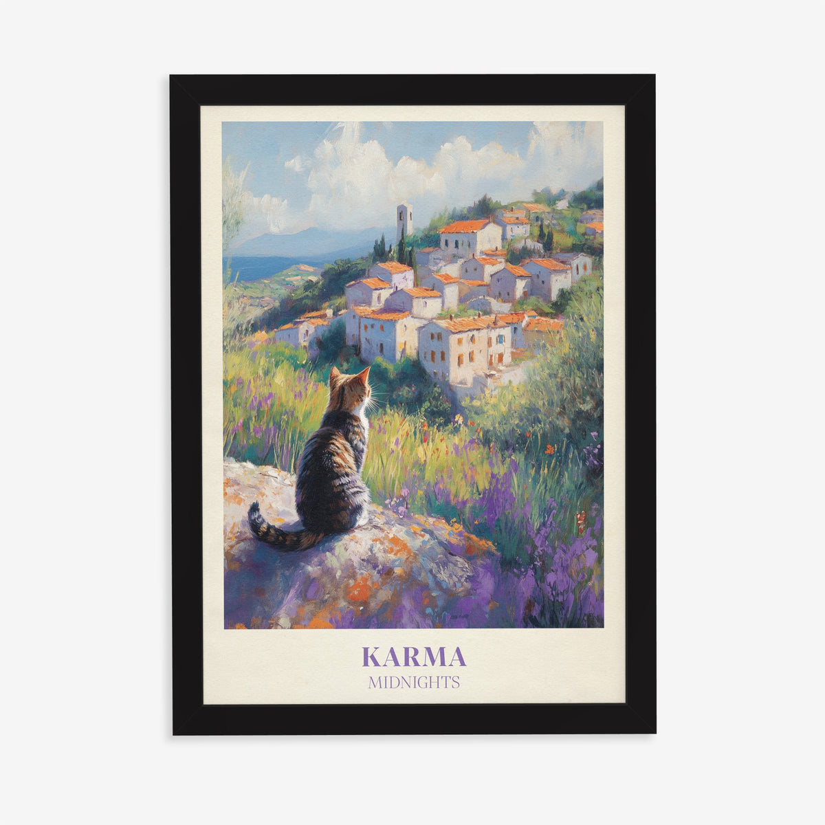 Karma Taylor Swift print of a tabby cat looking out over a hilltop village and lavender, in a black frame on a plain wall
