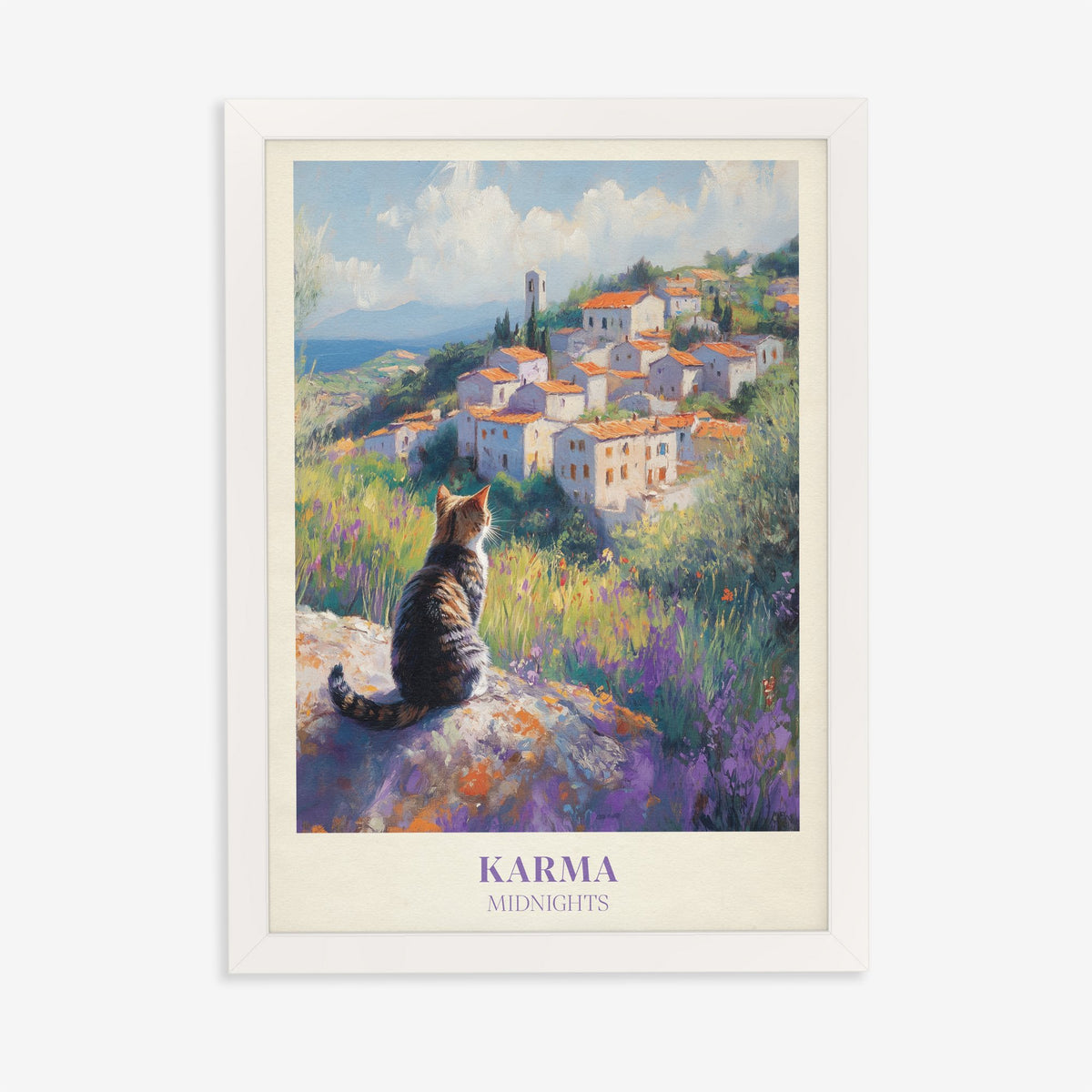 Karma Taylor Swift print of a tabby cat looking out over a hilltop village and lavender, in a white frame on a plain wall