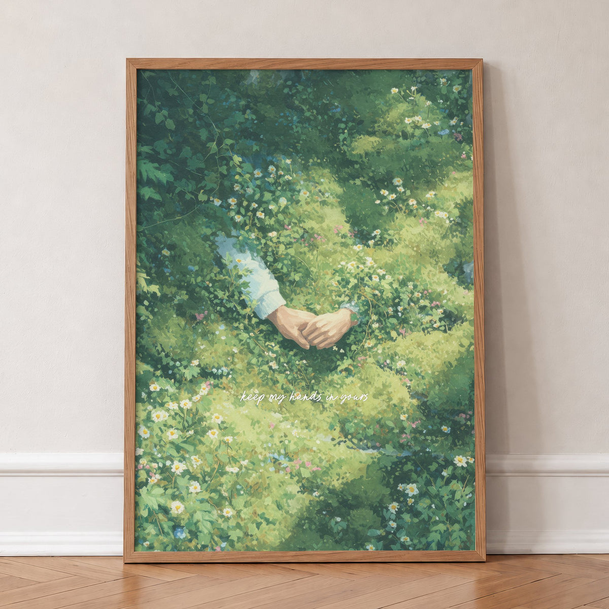 Keep My Hands In Yours Noah Kahan print of two hands held among daisies in a green garden, in an oak frame, leaning against a wall on a herringbone floor