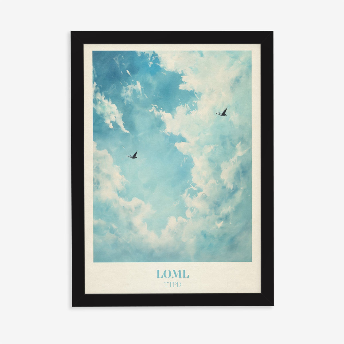 Loml Taylor Swift print of two birds flying through a bright blue sky of white clouds, in a black frame on a plain wall
