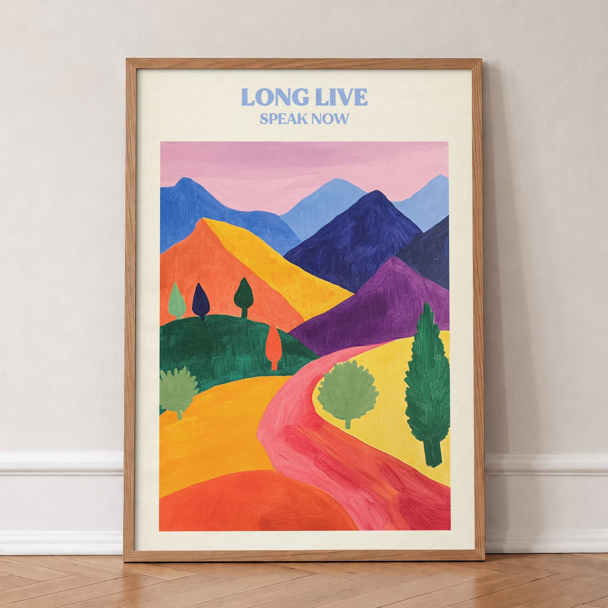 Long Live Matisse Taylor Swift print of a red path winding through bold, colourful hills, in an oak frame, leaning against a wall on a herringbone floor