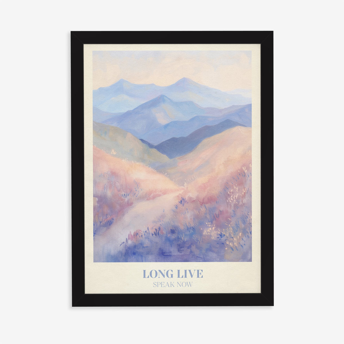 Long Live Taylor Swift print of rolling lavender and blue mountains, in a black frame on a plain wall