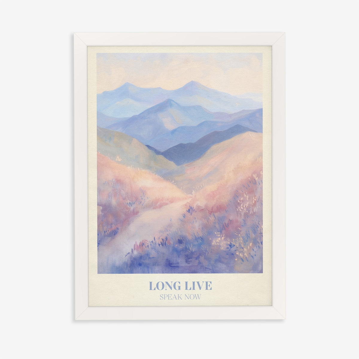Long Live Taylor Swift print of rolling lavender and blue mountains, in a white frame on a plain wall