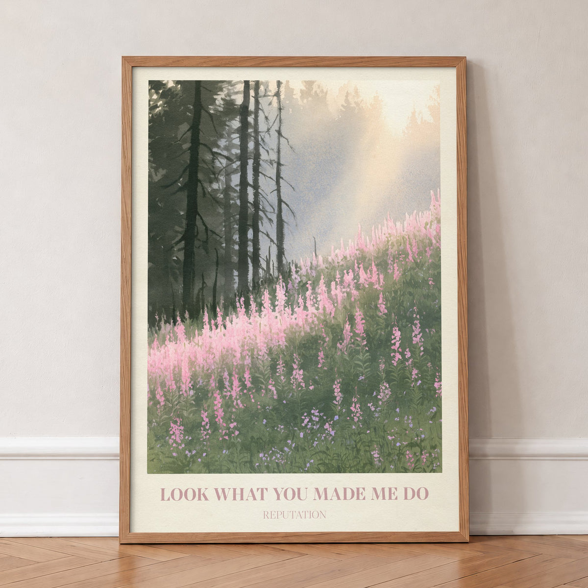 Look What You Made Me Do Taylor Swift print of pink wildflowers by pines, in an oak frame, leaning against a wall on a herringbone floor