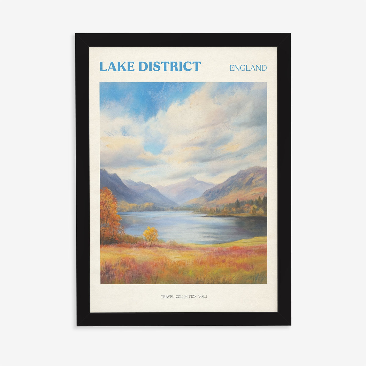 Lake District travel print of a lake between mountains under big clouds, with orange autumn grass, in a black frame on a plain wall