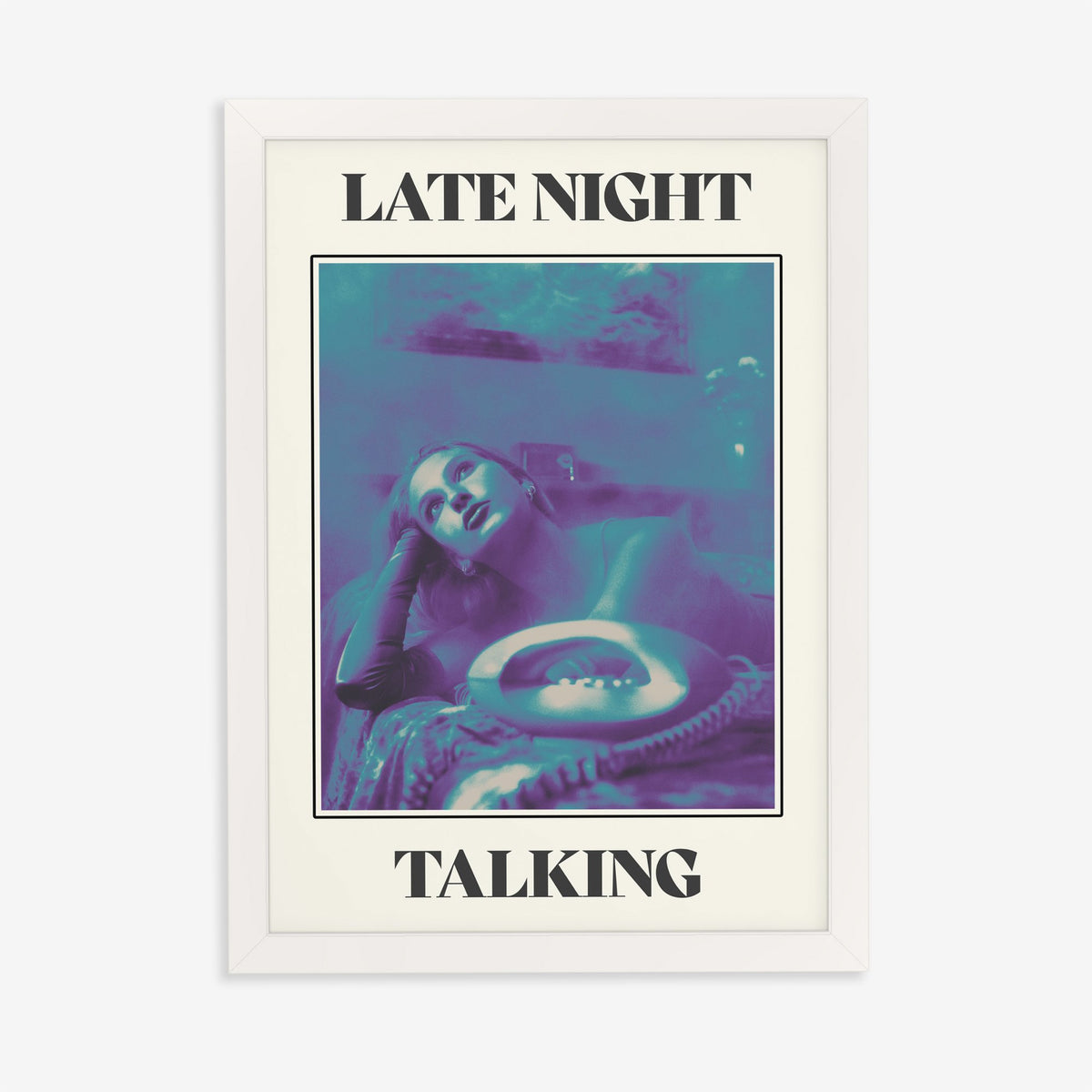 Late Night Talking Harry Styles print of a retro purple and teal phone photo, in a white frame on a plain wall