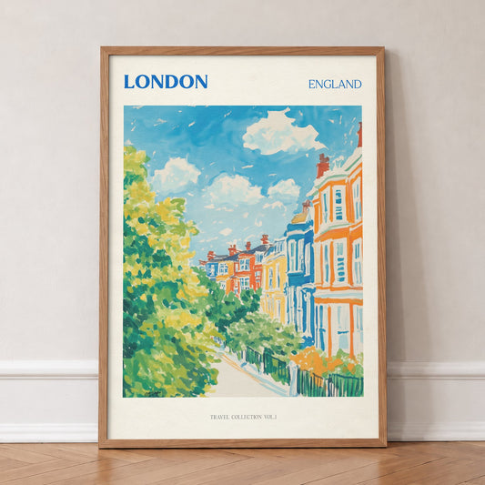 London travel print of colourful terraced houses behind green trees on a sunny street, in an oak frame, leaning against a wall on a herringbone floor