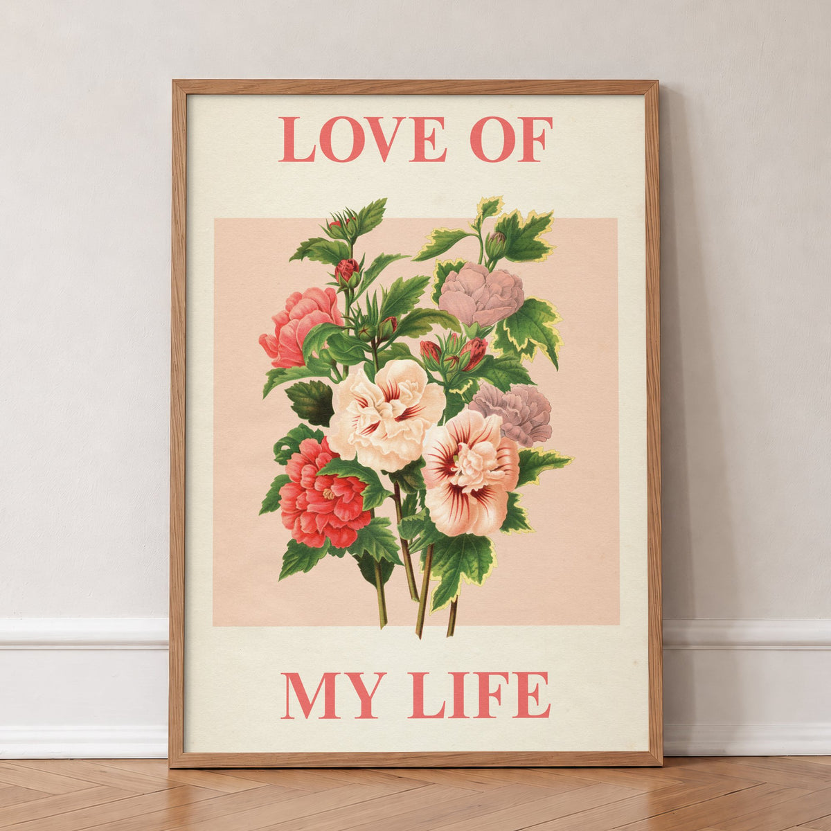 Love Of My Life Harry Styles print of pink and red roses on blush pink, in an oak frame, leaning against a wall on a herringbone floor