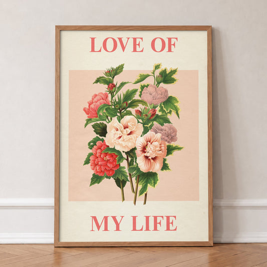 Love Of My Life Harry Styles print of pink and red roses on blush pink, in an oak frame, leaning against a wall on a herringbone floor