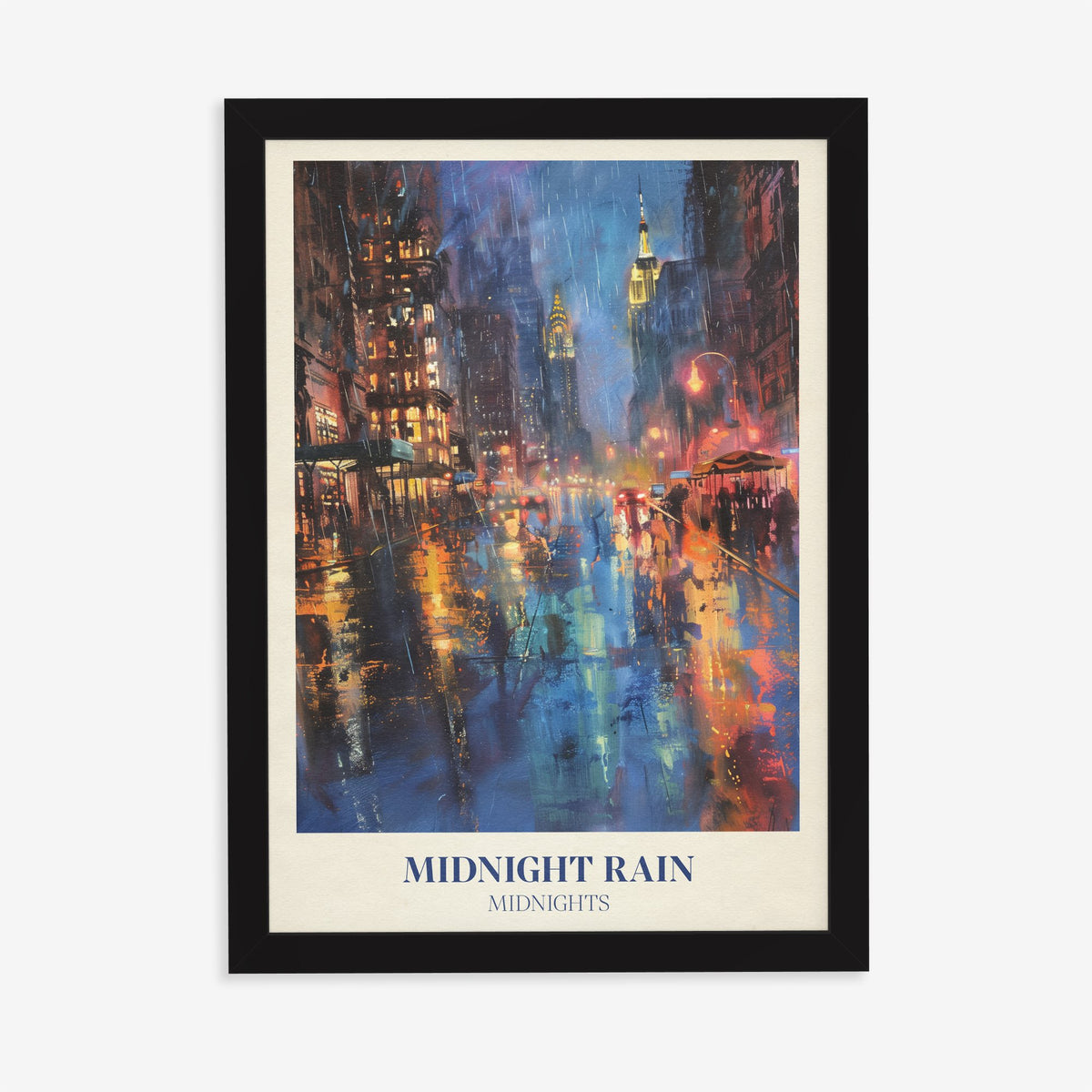 Midnight Rain Taylor Swift print of a rain-soaked city street glowing under skyscrapers at night, in a black frame on a plain wall