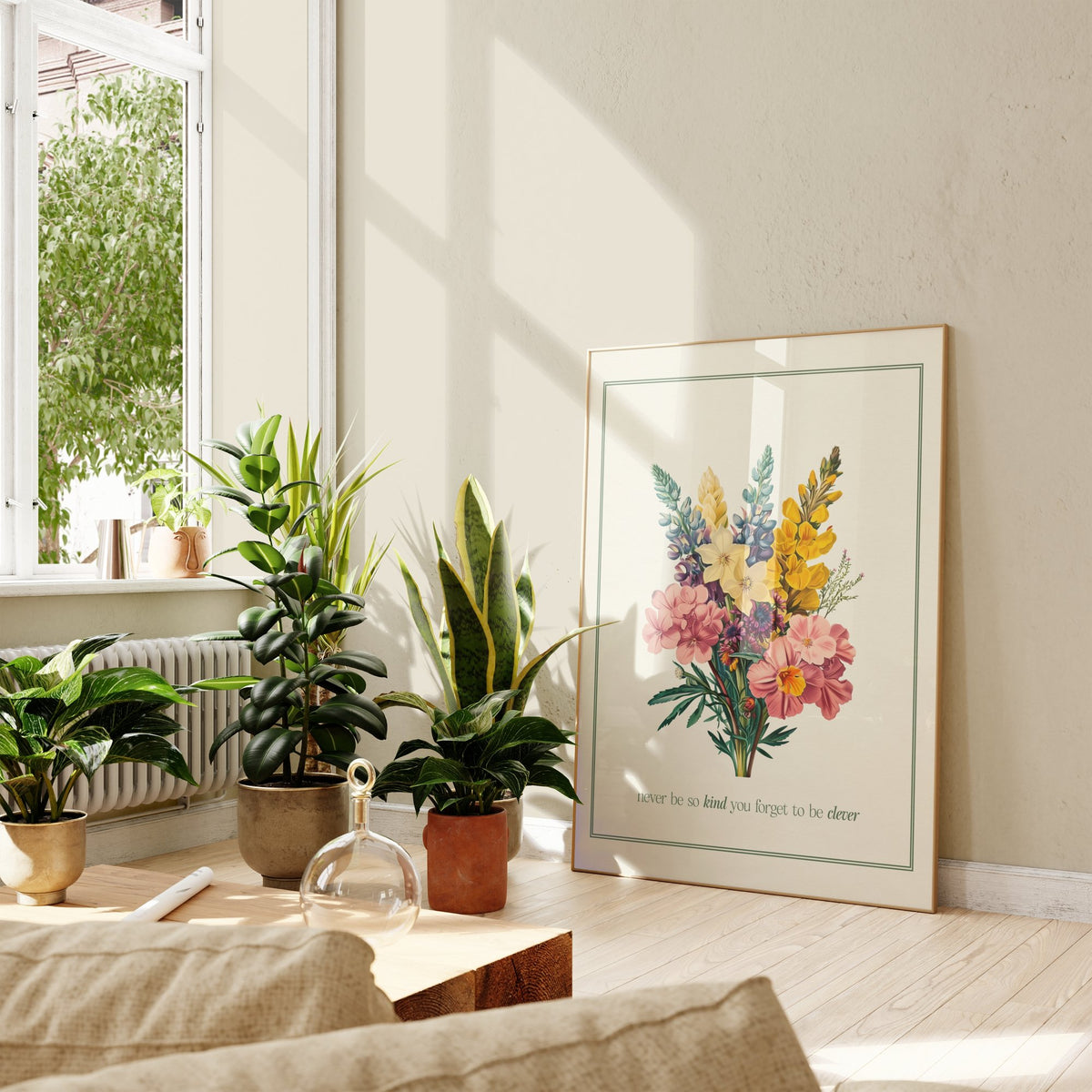 Never Be So Kind Bouquet Taylor Swift print of a vintage bouquet in a green border, framed, leaning against a wall beside potted plants