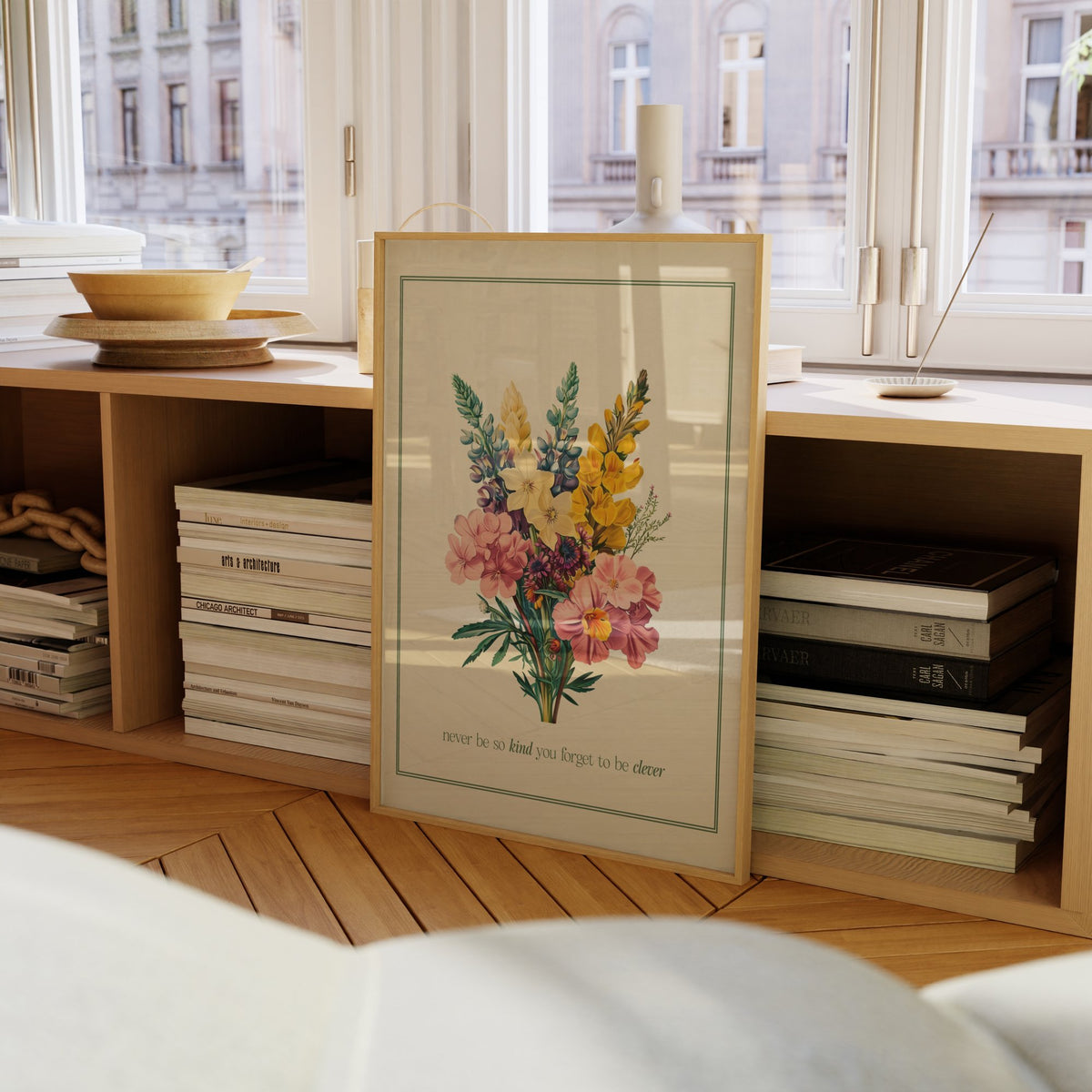 Never Be So Kind Bouquet Taylor Swift print of a vintage bouquet in a green border, framed on a bookcase by a window