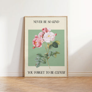 Never Be So Kind lyric print — pink and white botanical roses on sage green with the lyric Never be so kind you forget to be clever from Taylor Swift's Evermore