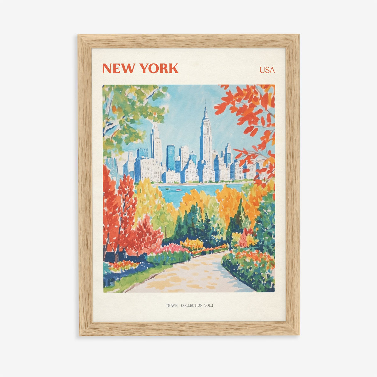 New York travel print of the Manhattan skyline behind bright red and orange trees, in an oak frame on a plain wall