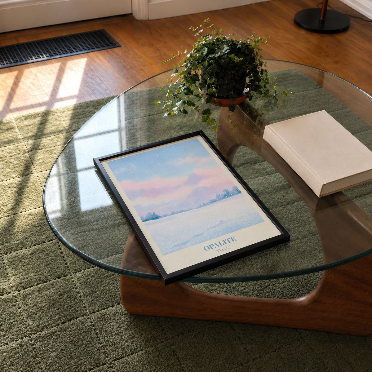 Opalite Winter Taylor Swift print of pink clouds over a snowy field, on a glass coffee table