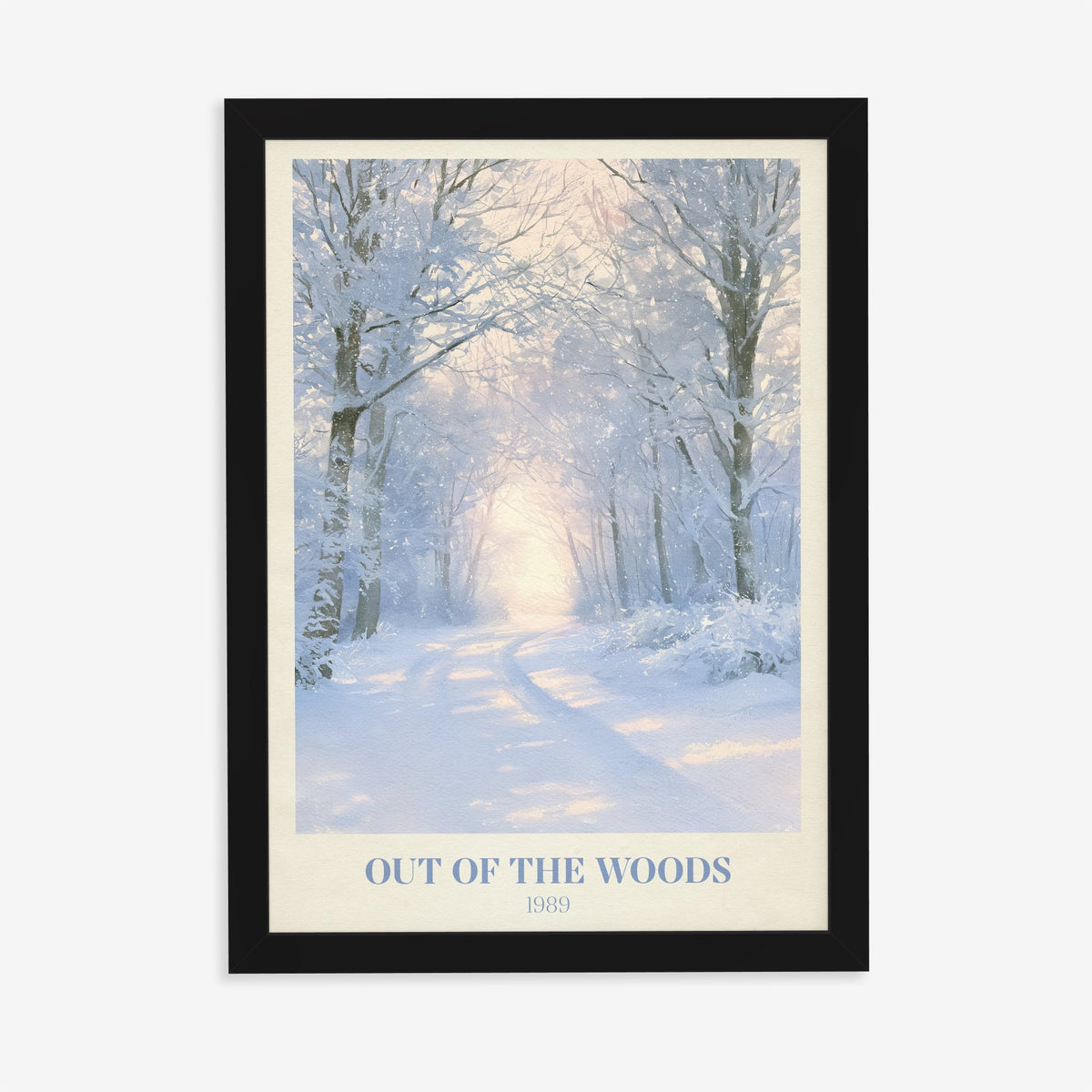 Out Of The Woods Winter Taylor Swift print of a snowy woodland path, in a black frame on a plain wall