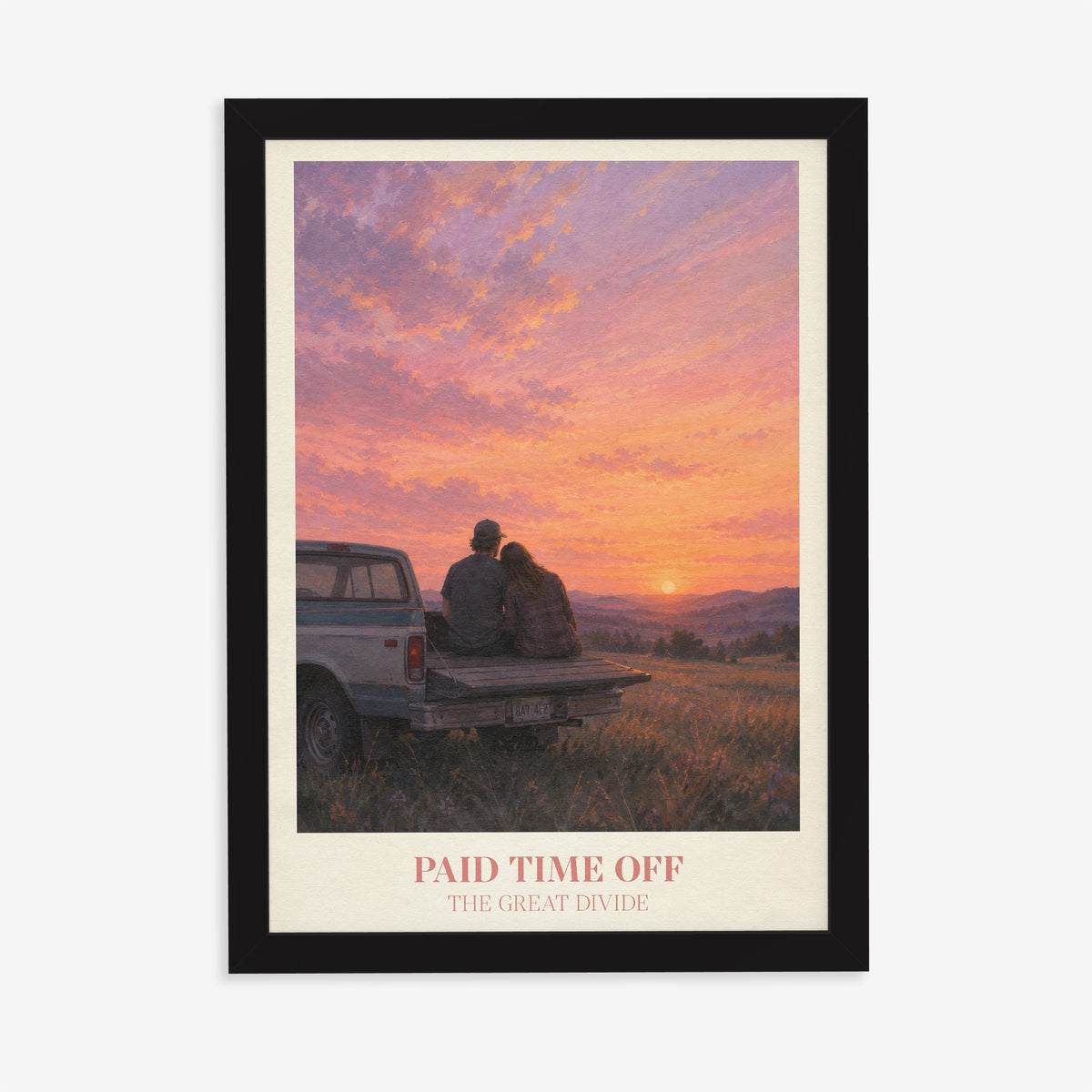 Paid Time Off Noah Kahan print of a couple on a truck watching a pink sunset, in a black frame on a plain wall