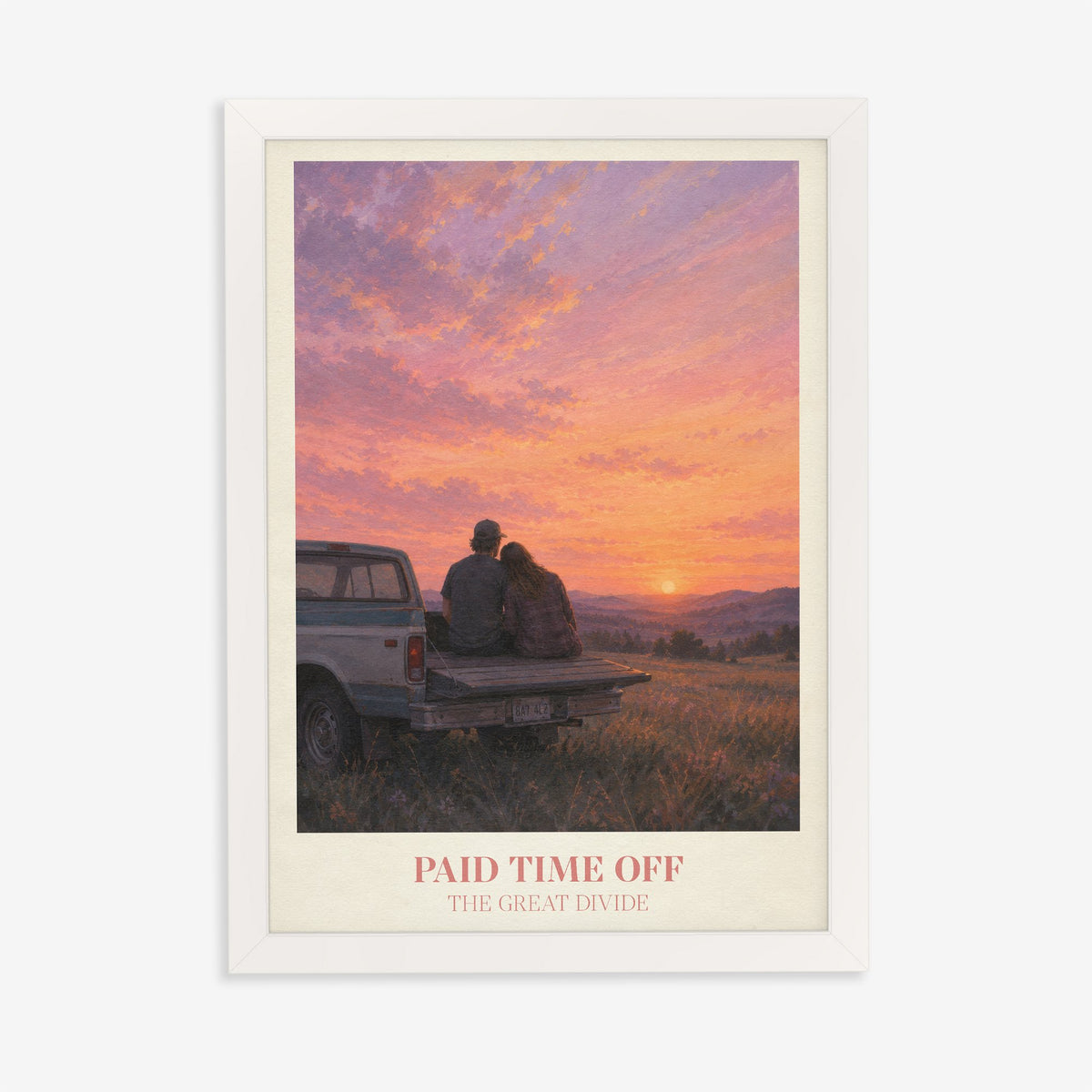 Paid Time Off Noah Kahan print of a couple on a truck watching a pink sunset, in a white frame on a plain wall
