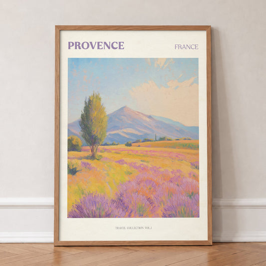 Provence travel print of purple lavender fields and a lone tree below a mountain, in an oak frame, leaning against a wall on a herringbone floor