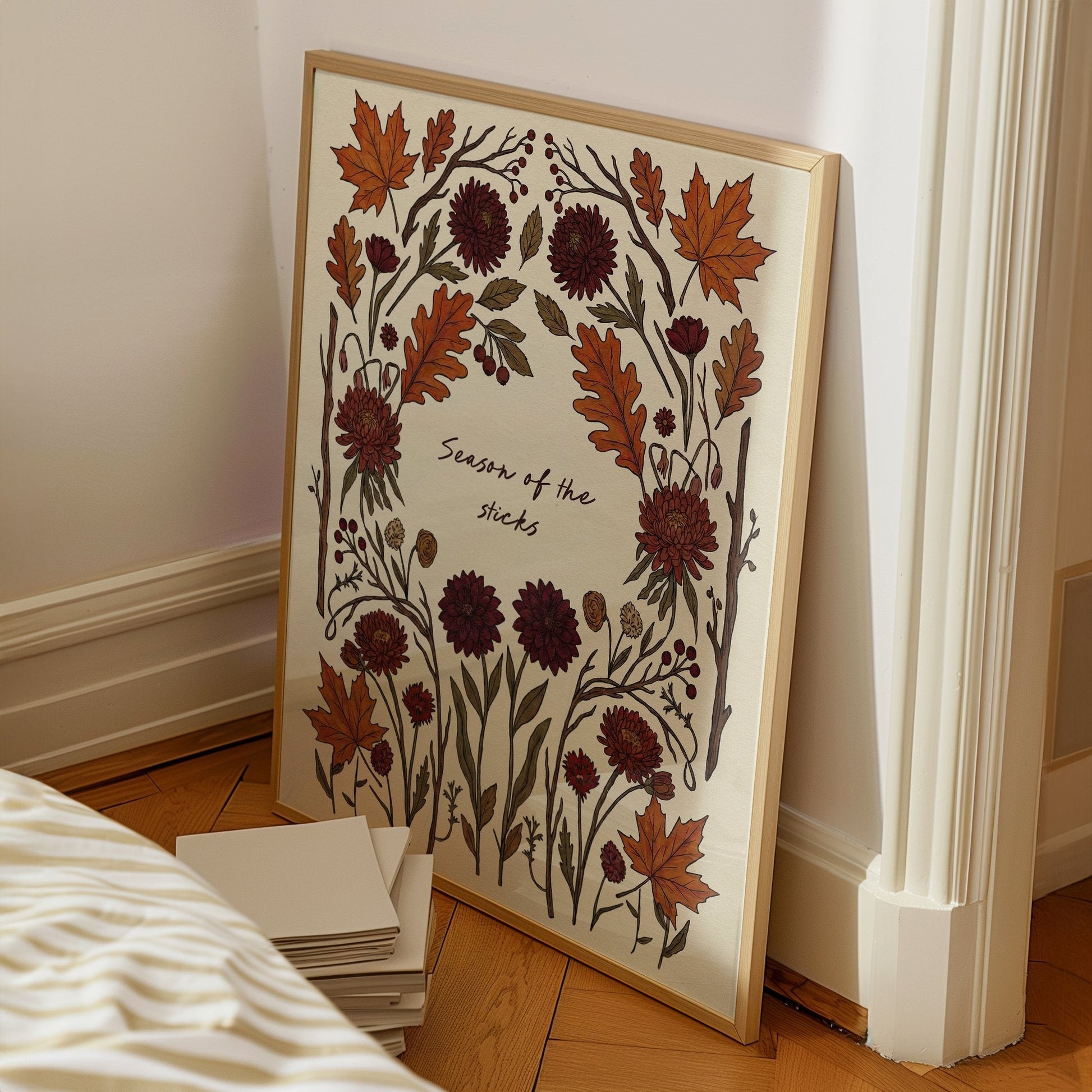 Season Of The Sticks lyric wall art print inspired by Noah Kahan on a bedroom floor, leaning against a white wall