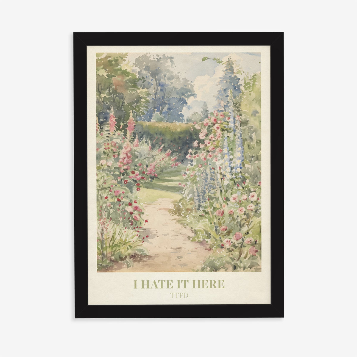I Hate It Here Taylor Swift print of a garden path lined with foxgloves and roses, in a black frame on a plain wall