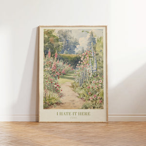I Hate It Here music print — an English cottage garden with hollyhocks and delphiniums lining a sunlit path, inspired by Taylor Swift's TTPD