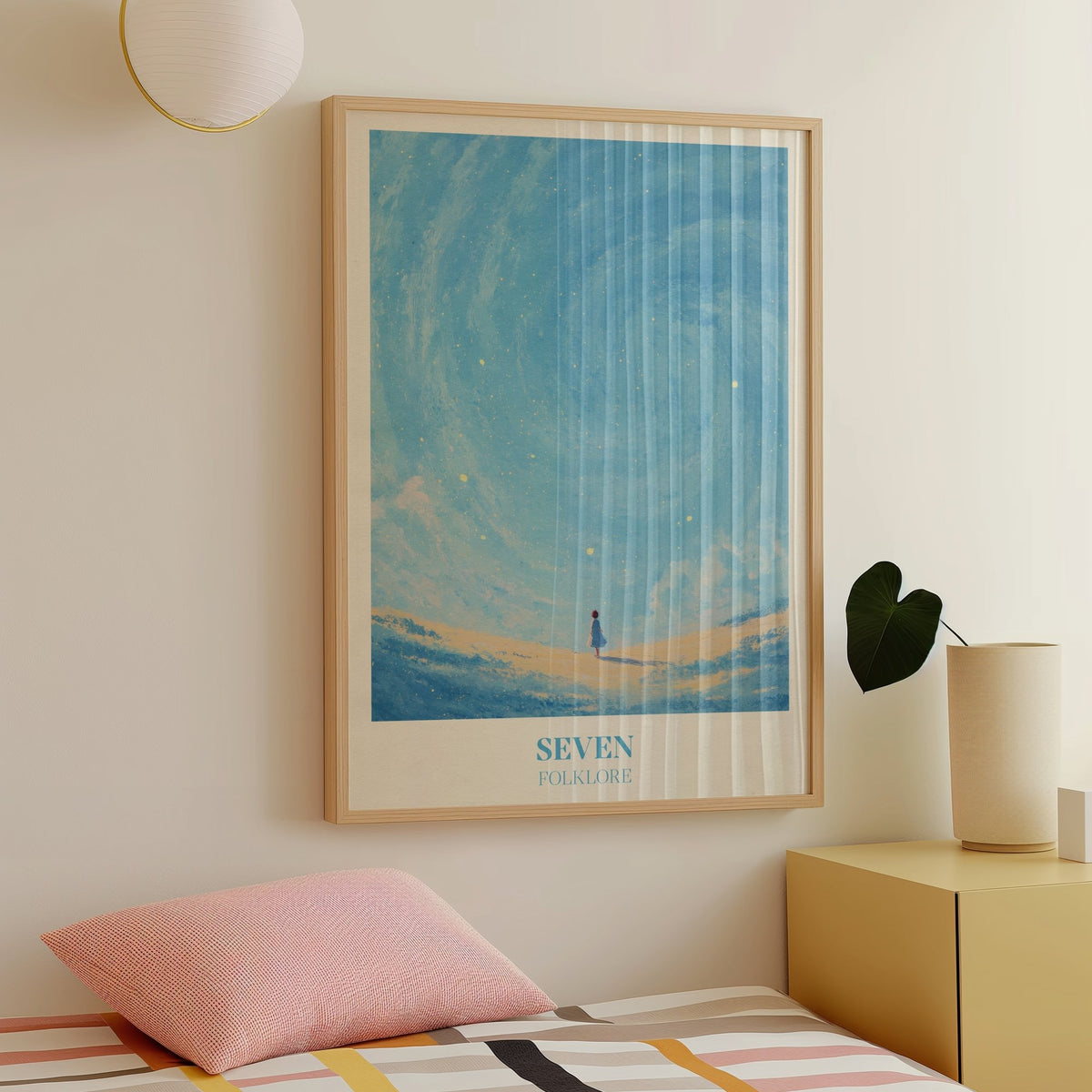 Seven Taylor Swift print of a little girl in a blue dress under a swirling, starry blue sky, framed above a bed