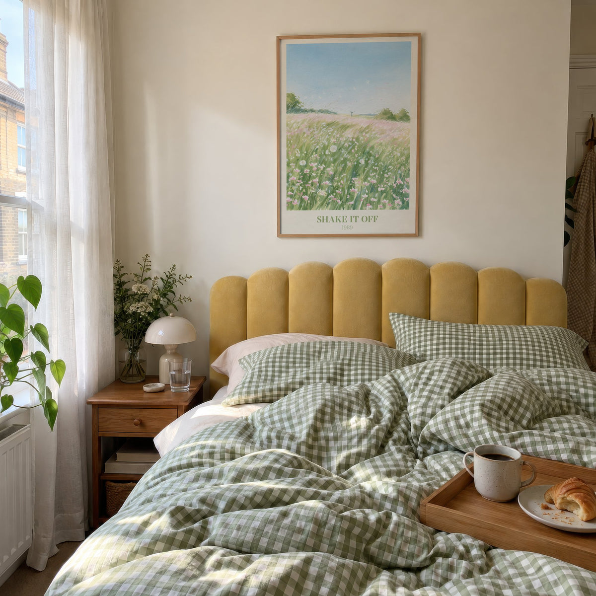 Shake It Off Taylor Swift print of a pink wildflower meadow, hung above a bed with green gingham bedding