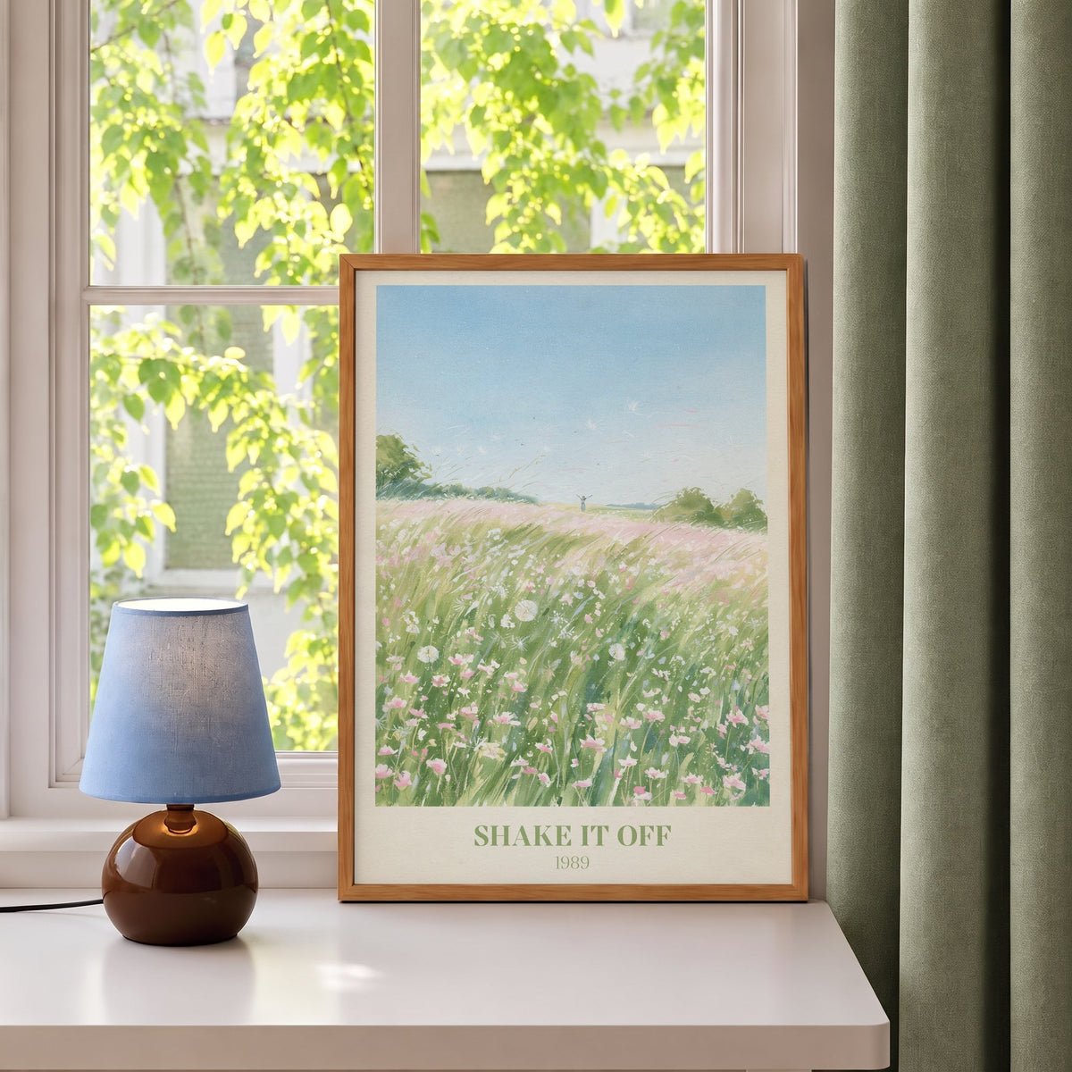 Shake It Off Taylor Swift print of a pink wildflower meadow, leaning on a windowsill beside a blue lamp