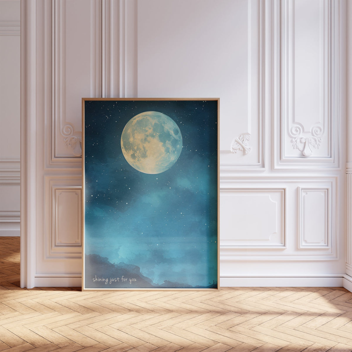 Shining Just For You Taylor Swift print of a full moon over a starry blue night sky, framed, leaning against a white panelled wall