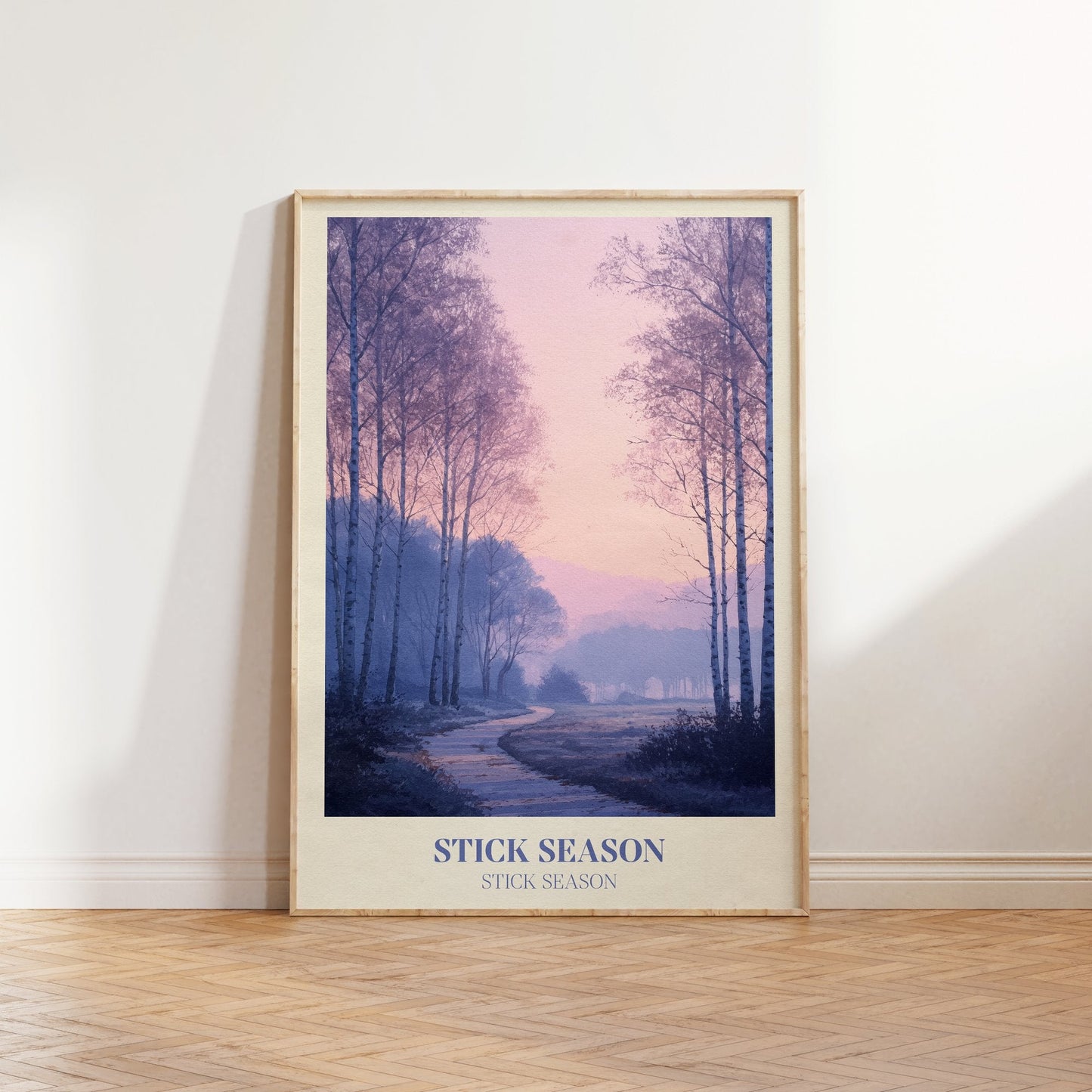 Stick Season lyric wall art print inspired by Noah Kahan leaning against a white wall on a wooden herringbone floor in soft daylight