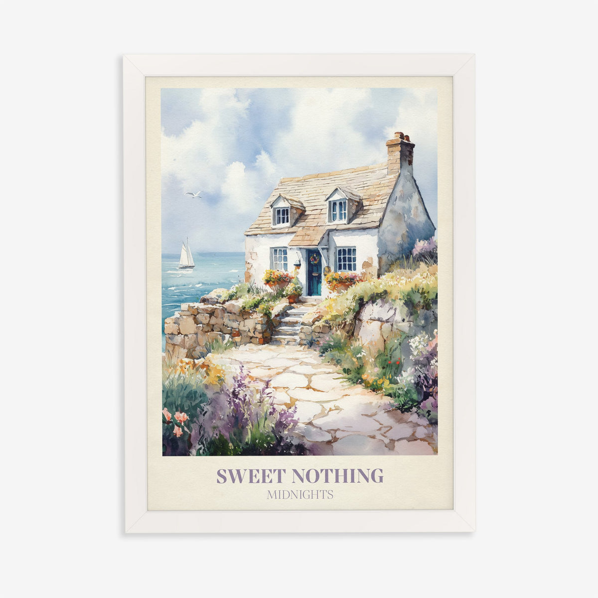 Sweet Nothing Taylor Swift print of a white seaside cottage with a stone path and wildflowers, in a white frame on a plain wall