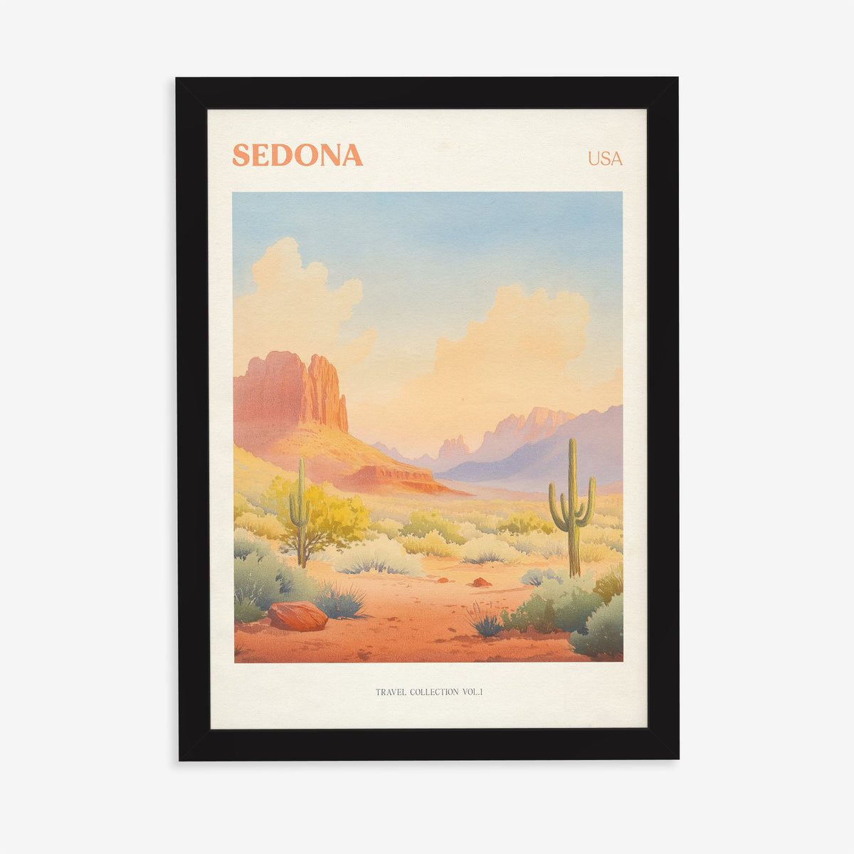 Sedona travel print of red rock formations and tall cacti under a peach desert sky, in a black frame on a plain wall