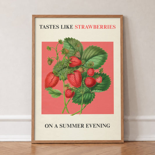 Strawberries On A Summer Evening Harry Styles print of strawberries on coral red, in an oak frame, leaning against a wall on a herringbone floor
