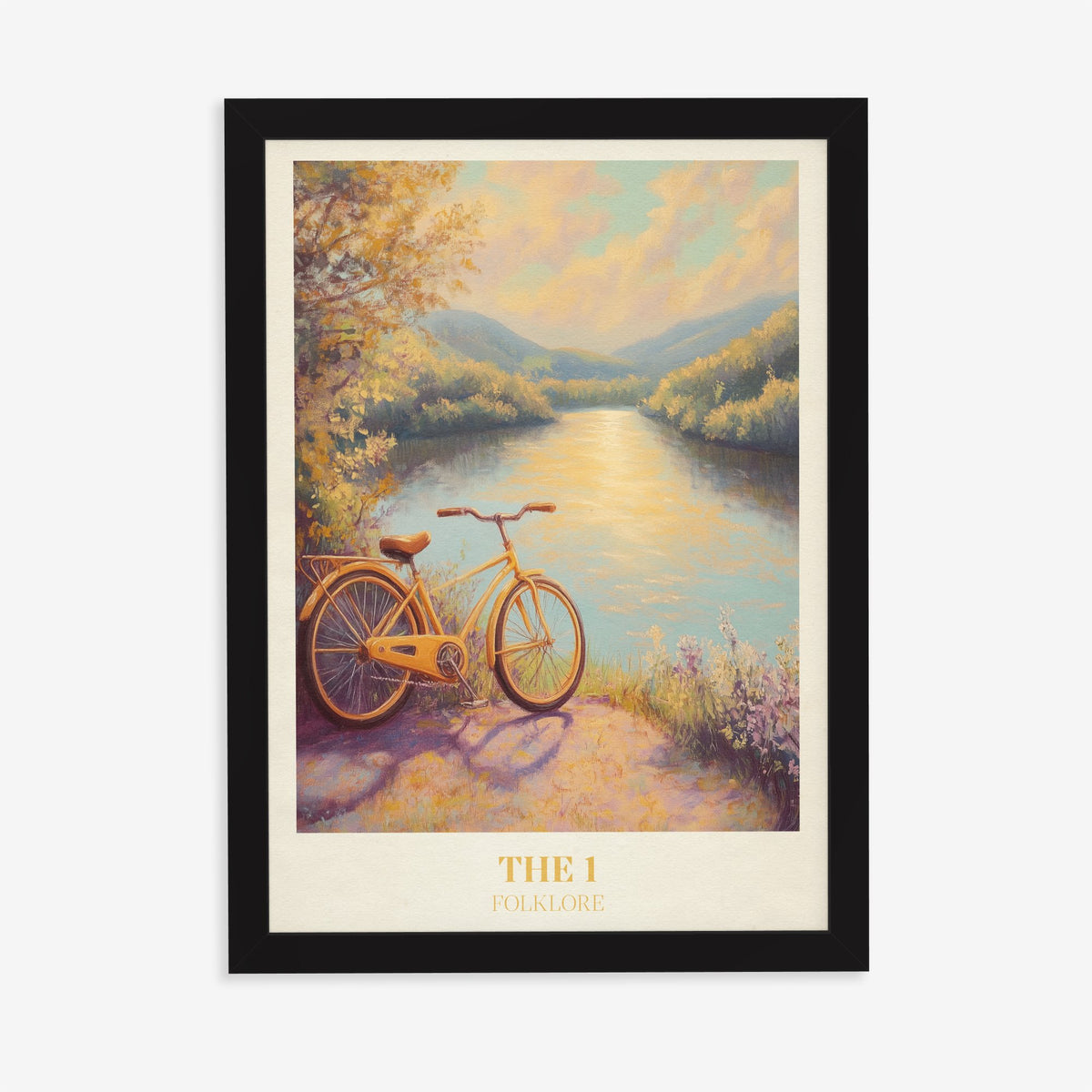The 1 Taylor Swift print of a yellow bicycle beside a sunlit river, in a black frame on a plain wall