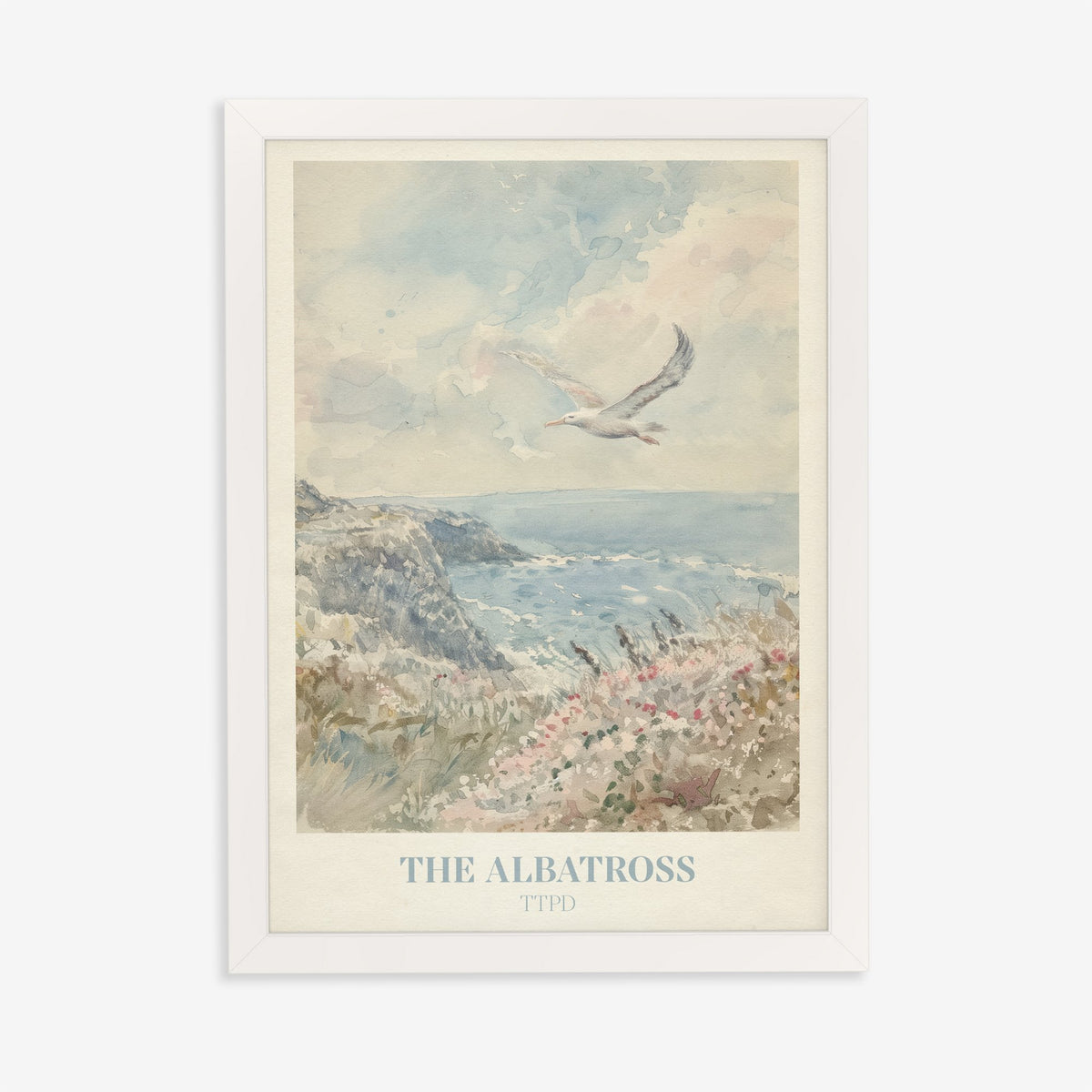 The Albatross Taylor Swift print of a seabird over a clifftop of pink wildflowers, in a white frame on a plain wall