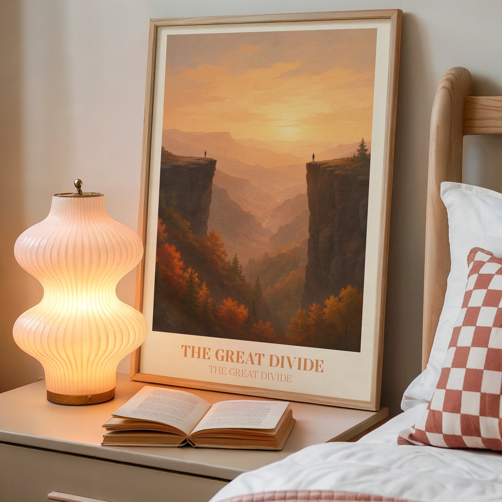 The Great Divide lyric wall art print inspired by Noah Kahan on a bedside table next to a lamp