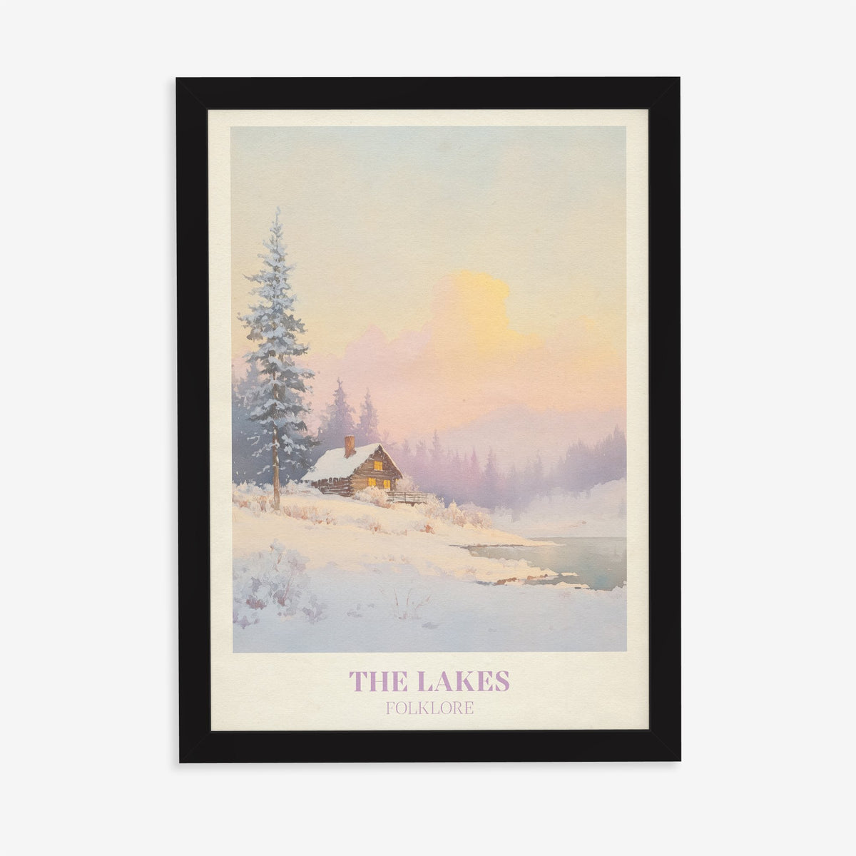 The Lakes Christmas Taylor Swift print of a snowy log cabin by a lake under a pink sky, in a black frame on a plain wall