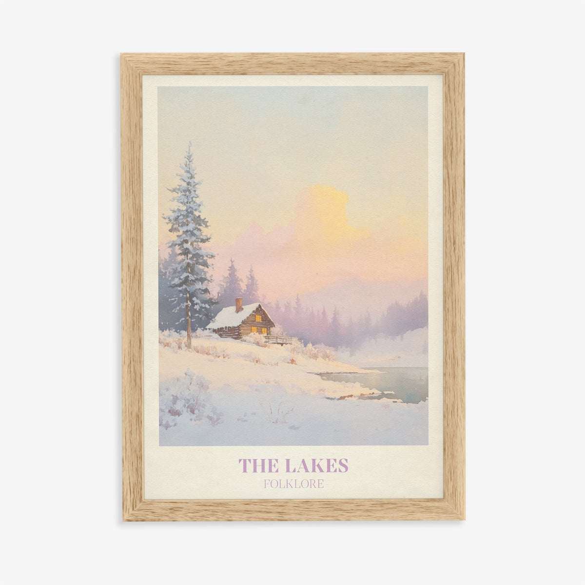 The Lakes Christmas Taylor Swift print of a snowy log cabin by a lake under a pink sky, in an oak frame on a plain wall